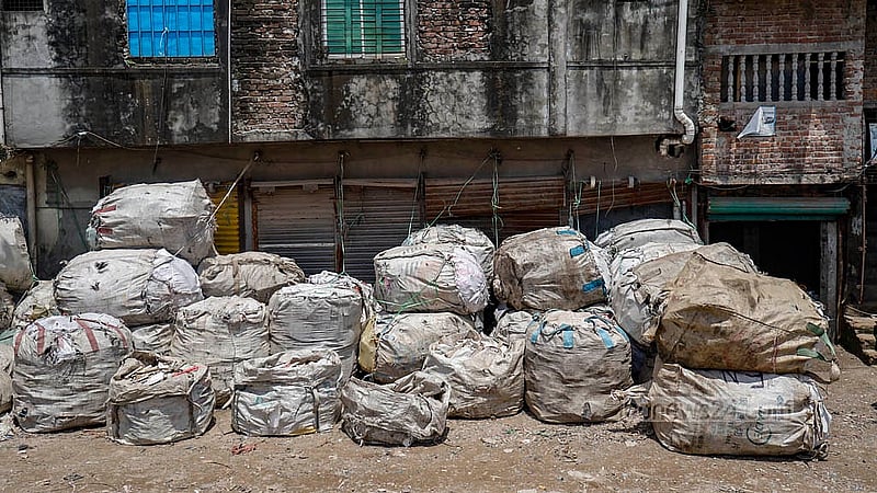 Rows of white bags, stuffed with discarded plastics of every kind, line both sides of the road from the Buriganga’s original channel through West Islambagh in Old Dhaka. Photo: Mahmud Zaman Ovi
