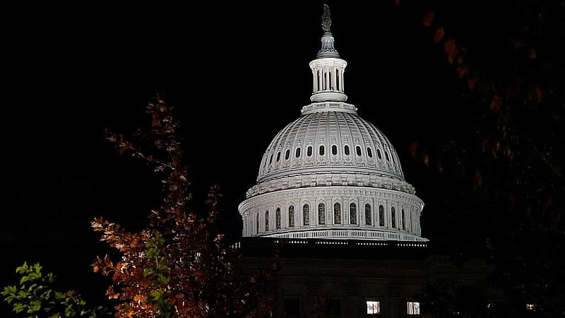The US Capitol building is illuminated the night the Senate passed a short-term government funding bill, more than a month into the longest US government shutdown, on Capitol Hill in Washington, DC, US, Nov 10, 2025. REUTERS/Elizabeth Frantz