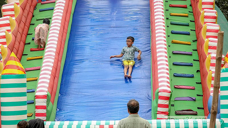 A child plays in the children’s corner at the Baishakhi Fair at the Bangla Academy premises on Saturday, Apr 18, 2026. The seven-day fair will end on Monday.