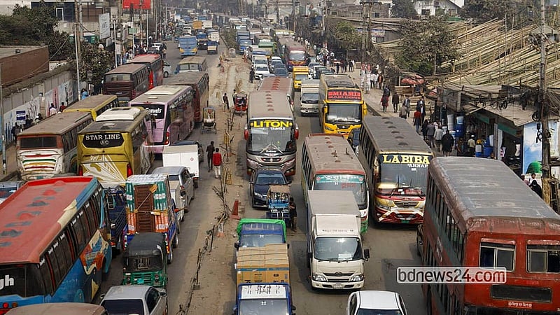Rickshaw drivers block the road at Pragati Sarani in Dhaka's Badda on Monday morning, causing an extensive traffic jam. Photo: Mahmud Zaman Ovi