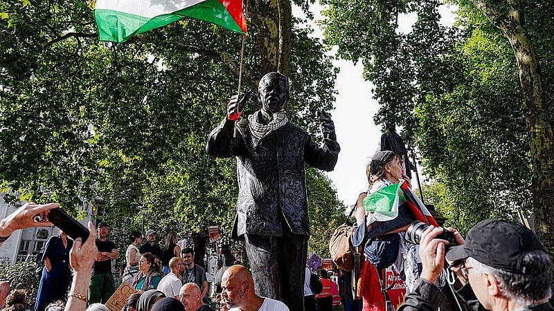 A Palestinian flag is attached to a monument on the day of the &amp;quot;Lift The Ban&amp;quot; rally organised by Defend Our Juries, challenging the British government's proscription of &amp;quot;Palestine Action&amp;quot; under anti-terrorism laws, in Parliament Square, in London, Britain, September 6, 2025. REUTERS