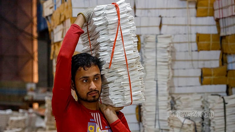 Workers are busy printing secondary school books at a printing house in Dhaka’s Matuail. Photo: Mahmud Zaman Ovi
