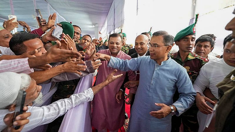 Prime Minister Tarique Rahman exchanges greetings with the public after the main Eid-ul-Fitr congregation at the National Eidgah on Saturday, Mar 21, 2026. Photo: PMO