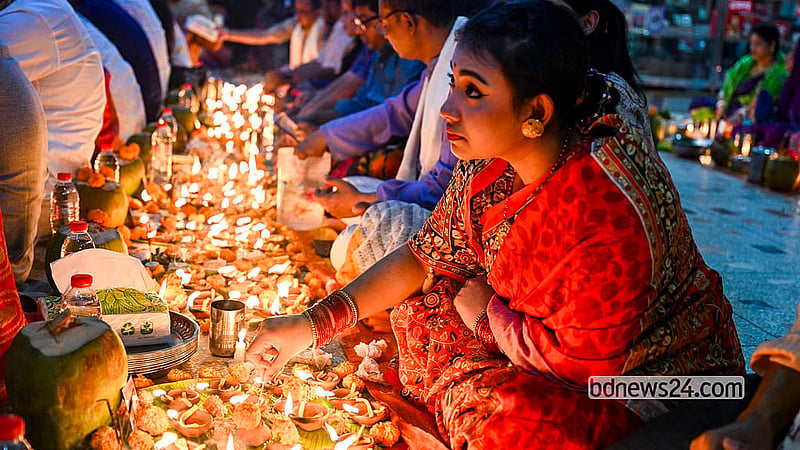 A female devotee prays during Rakher Upobash at the Swamibagh Loknath Ashram in Dhaka. Photo: Muhammad Mostafigur Rahman