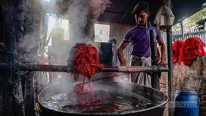 The fabric is boiled in water for five to ten minutes to fix the colours. Almost every household in Banti village in Narayanganj's Araihazar is involved in batik production. Photo: Mahmud Zaman Ovi
