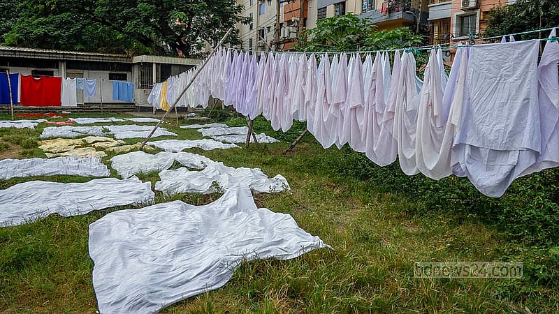 A clothes-drying area has been set up in the free space outside the temporary court in the Alia madrasah field using bamboo and rope. Clothes are being dried on rows of bamboo poles. Photo: Mahmud Zaman Ovi