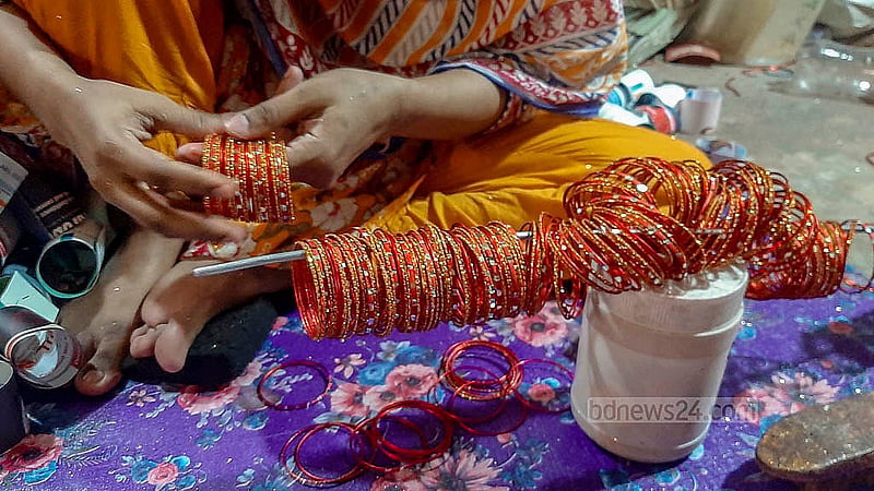 Bangles of various designs and colours are made from silver wire in Dhaka’s Lalbagh. A handful of bangles are sold wholesale for Tk 8-20, depending on the size. Photo: Abdullah Al Momin