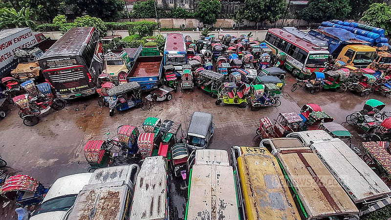 Buses, trucks, and other impounded vehicles are lined up at the dumping station on the north side of Dhaka's Postogola Bridge. Photo: Abdullah Al Momin
