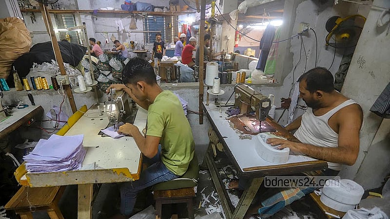 Craftsmen at a skull cap factory in Kamrangirchar are busy ahead of Eid-ul-Fit. Photo: Abdullah al Momin