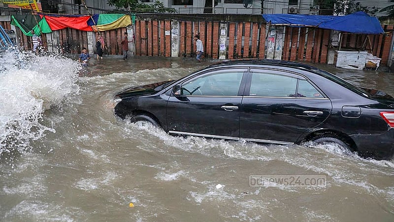 The streets in Dhaka's New Market area faced waterlogging after the rain on Monday, Sept 22, 2025, leaving private cars half-submerged. Photo: Mahmud Zaman Ovi