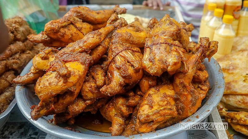 Many shops at the Iftar market in Chawkbazar display whole chickens prominently for shoppers on Thursday, Feb 19, 2026. Photo: Abdullah al Momin