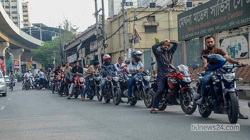 Long lines of motorcycles wait outside a filling station in Paribagh on Monday, Mar 23, 2026. Photo: Abdullah Al Momin