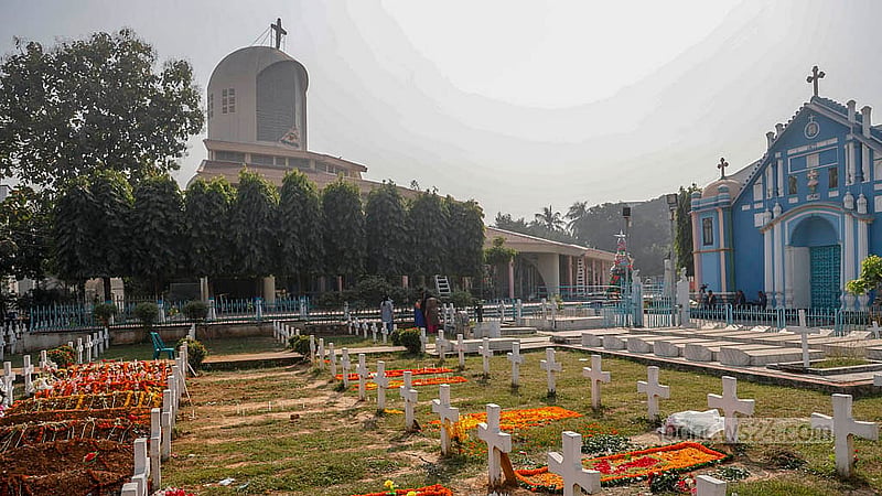 Christmas flowers placed on the graves of loved ones at the church cemetery in Tejgaon. Photo: Mahmud Zaman Ovi