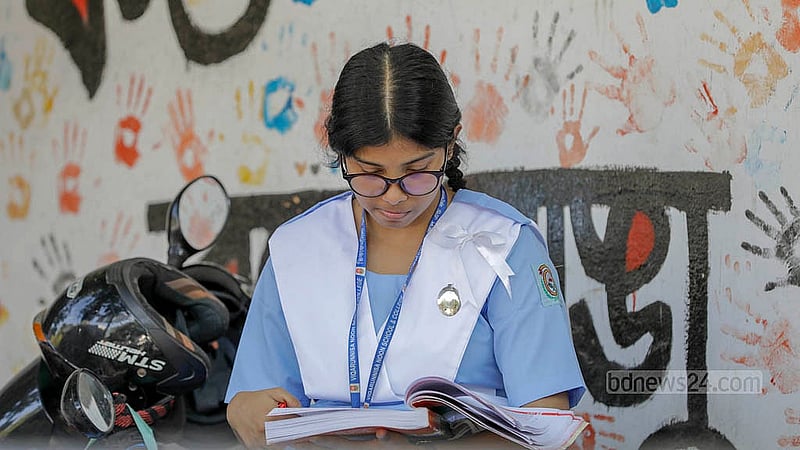 A student checks the seating arrangement at Motijheel Ideal School and College centre before the SSC exams begin on Thursday morning on Thursday, Apr 10, 2025. Photo: Mahmud Zaman Ovi