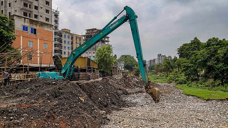 Dhaka North City Corporation workers excavate Ramchandrapur canal in Mohammadpur.