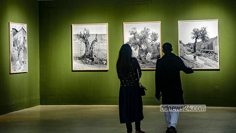 Visitors explore exhibitions at the international photography festival Chobi Mela at the National Art Gallery Auditorium of the Bangladesh Shilpakala Academy. Photo: Abdullah al Momin