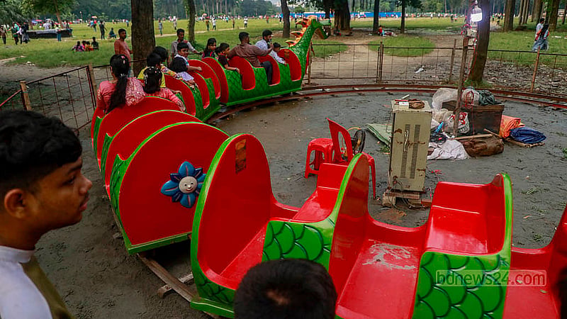 Several rides are set up for children's entertainment outside the Ramna Kali Temple during the Durga Puja celebrations.