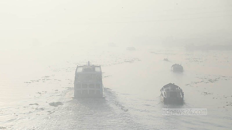 Vessels navigate the Buriganga River through the morning fog, seen from Dhaka’s Postogola Bridge. Photo: Abdullah Al Momin