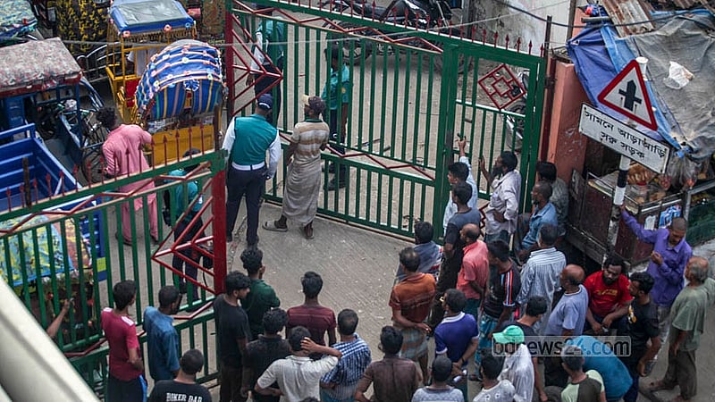 Outside the main gate of the Postogola dumping station, large crowds gather daily, waiting to reclaim their seized vehicles. Photo: Abdullah Al Momin