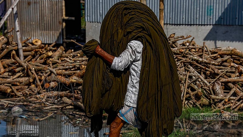 Freshly dyed cloths are transported from the factory to dry under the open sky in Narayanganj’s Fatullah Post Office area. Photo: Mahmud Zaman Ovi