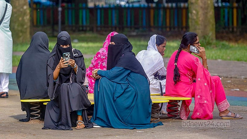 A group of young women use a piece of playground equipment at the children’s corner in Dhaka’s Ramna Park. Photo: Mahmud Zaman Ovi