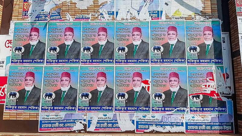 Candidates ignore the ban on paper posters for the national election campaign, pasting colourful posters on different walls across Old Dhaka. Photo: Abdullah Al Momin