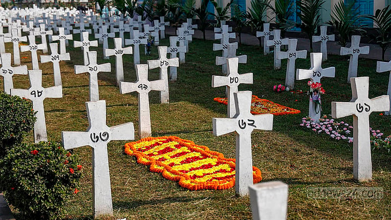Christmas flowers placed on the graves of loved ones at the church cemetery in Tejgaon. Photo: Mahmud Zaman Ovi