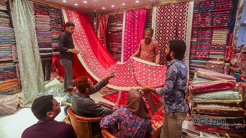 Traders display a wide variety of designs to catch the attention of potential customers as sales heat up at Benarasi Palli in Dhaka’s Mirpur. Photo: Abdullah al Momin