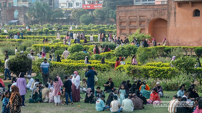 Tourists paused on the open lawns of Lalbagh Fort to rest and enjoy the atmosphere.  Photo: Abdullah al Momin