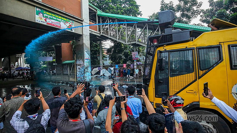 Police use water cannons on Sunday, Oct 12, 2025, to disperse MPO-listed teachers and employees staging a sit-in in front of the National Press Club, demanding higher house rent allowances.