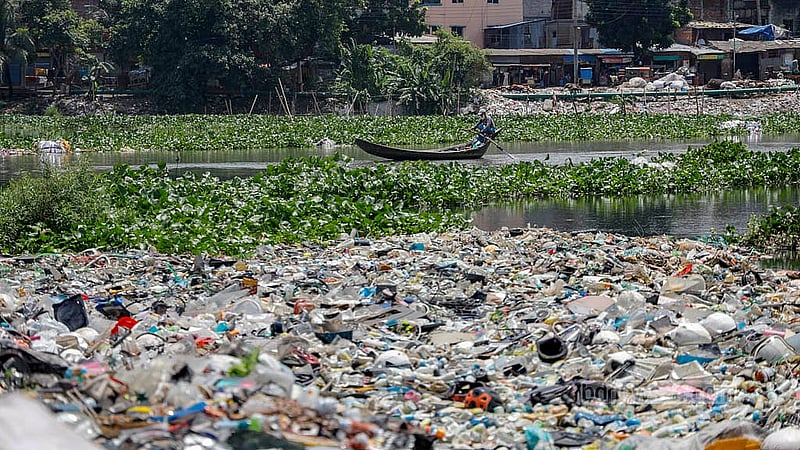 Several types of plastic float along the original channel of the Buriganga River, tangled in the water hyacinths. Photo: Mahmud Zaman Ovi