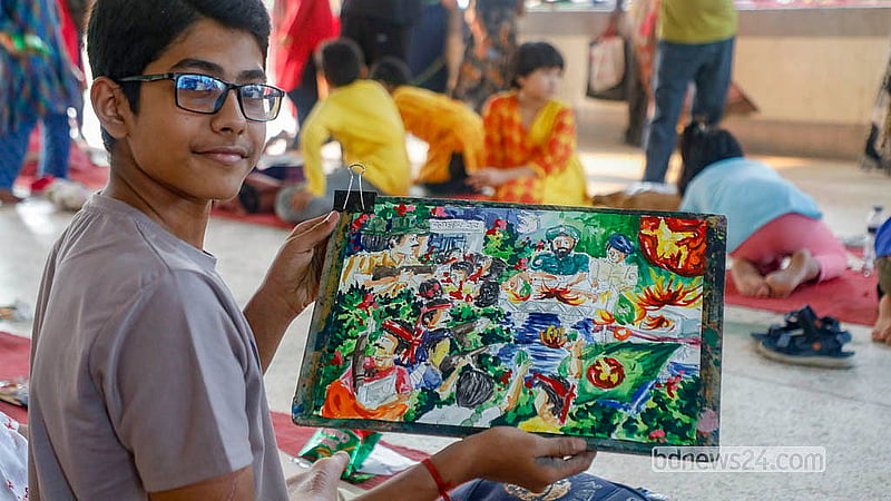 A young artist displays their work following a competition at Dhaka University’s Jagannath Hall on Wednesday, Mar 25, 2026, held to commemorate the victims of the 1971 Black Night. Photo: Abdullah Al Momin