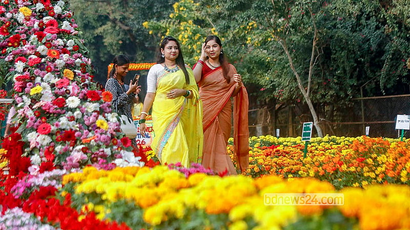 Visitors stroll through the Flower Festival at Ramna Park. The three-day event has been organised by the Public Works Department. Photo: Abdullah al Momin