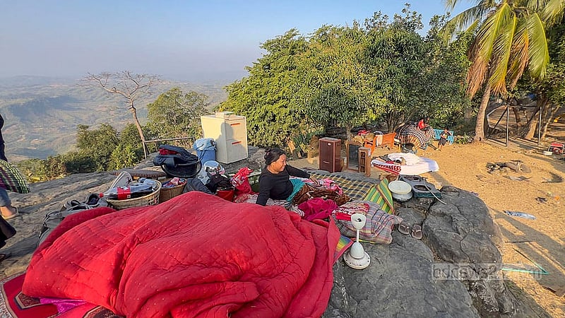 Many members of the Lushai and Tripura ethnic communities lost their homes in the massive blaze on Monday. They spent the night without a roof over their heads, bundled up among whatever belongings they were able to save. Photo: Samir Mallik