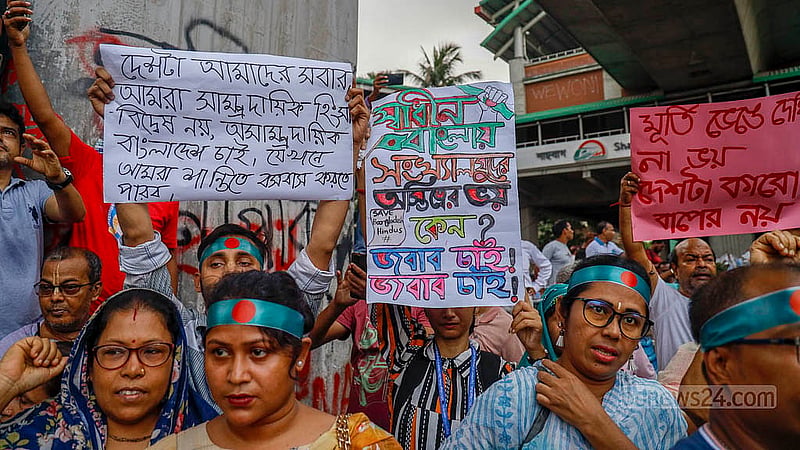 People of all ages hold placards at a protest rally by Hindu devotees at Shahbagh intersection in Dhaka on Saturday, Aug 10, 2024. Photo:Mahmud Zaman Ovi