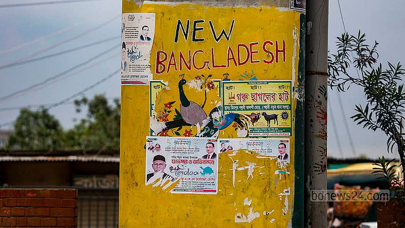 "New Bangladesh" is written in graffiti on a pillar of the Kalshi Flyover in Mirpur. Some artworks commemorating the July Uprising is below it, but have been covered with posters for sacrificial animal markets. Now, some of the posters have been removed but the original look has yet to be restored. Photo: Mahmud Zaman Ovi