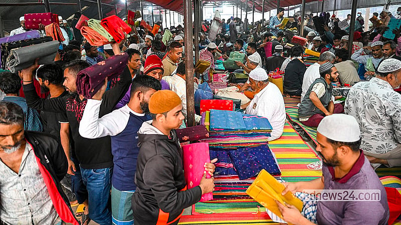 Buyers and sellers negotiate prices and examine fabrics as sari trading continues throughout the morning. Photo: Mostafigur Rahman