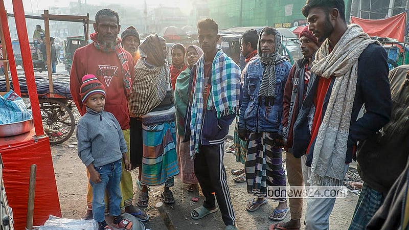 A day labourer family arrives at the Hemayetpur bus terminal area in Savar with a child. Photo: Abdullah Al Momin