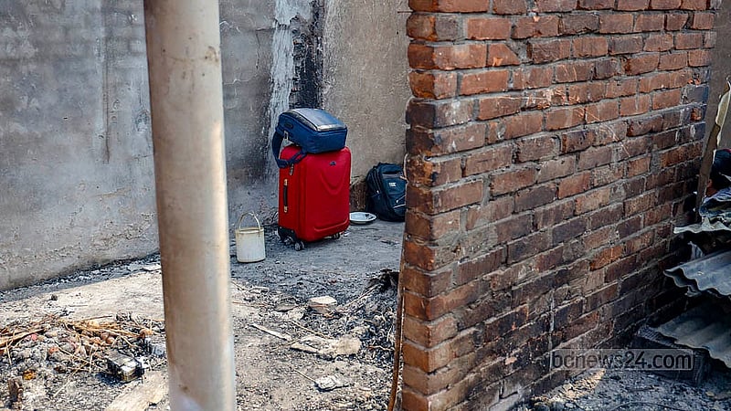 As the fire spread, she fled with whatever she could grab and stuffed into a bag. Returning afterwards, she found nothing left of her home. Photo: Mahmud Zaman Ovi