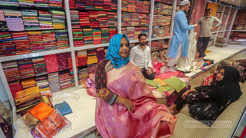 Customers browse the different stores at Benarasi Palli in Dhaka’s Mirpur. Many try on sarees before making purchases. Photo: Abdullah al Momin