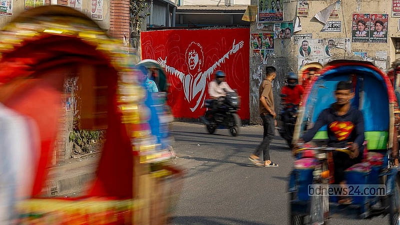 A graffiti portrait of Osman Hadi, the convenor of Inqilab Moncho, covers a wall in front of Hazaribagh Police Station in Old Dhaka. Photo: Mahmud Zaman Ovi