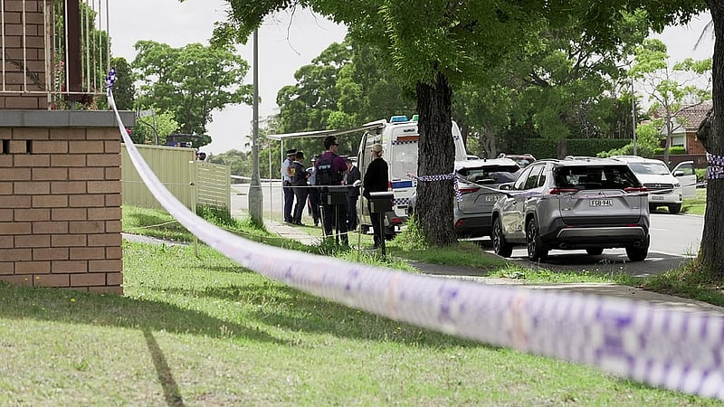Police officers stand guard outside the house of the suspects of a shooting incident on a Jewish holiday celebration at Bondi Beach, in Bonnyrigg, Sydney, Australia, Dec 15, 2025. REUTERS/Alasdair Pal