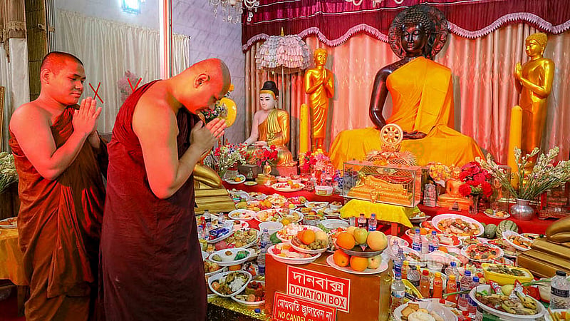 A monk prays in front of a statue of Lord Buddha at Dharmarajik Buddhist Mahavihara in Dhaka’s Sabujbagh on Buddha Purnima on Wednesday, May 22, 2024. Photo: Mahmud Zaman Ovi