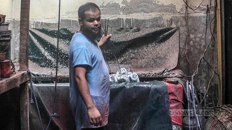Silver bangles are soaked in water mixed with chemicals at a bangle factory in Dhaka’s Lalbagh. Photo: Abdullah Al Momin