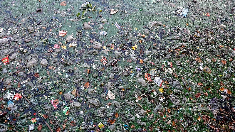 Plastic waste is visible in many spots around Hatirjheel, both along the banks and in the water. Photo: Mahmud Zaman Ovi