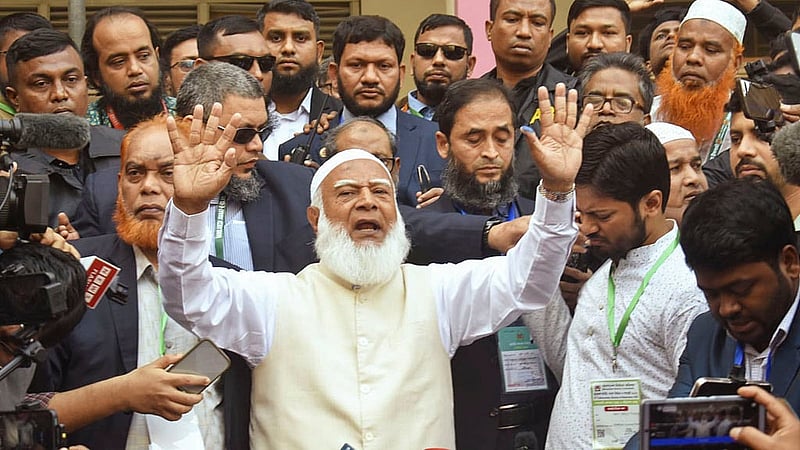 After voting, Shafiqur Rahman speaks to journalists at the polling station.