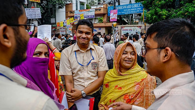 Examinees discuss their HSC test with their parents and guardians outside the examination centre on Sunday, Jun 30, 2024, the first day of the public exams. Photo: Mahmud Zaman Ovi