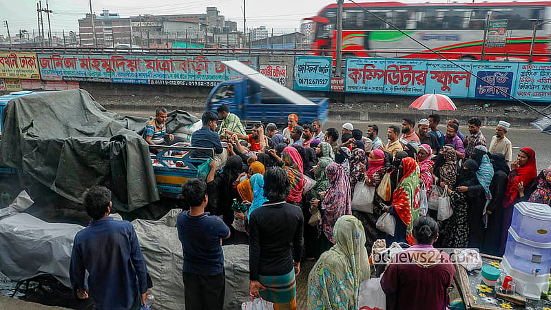People line up to purchase low-priced goods from a TCB truck in Dhaka’s Jatrabari. The subsidised sales scheme ahead of Eid-ul-Azha will continue until May 21. Photo: Abdullah Al Momin
