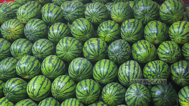 nside a warehouse at Badamtoli Ghat, workers stack watermelons shipped from Gowainghat in Sylhet. Photo: Abdullah Al Momin