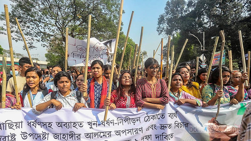 Dhaka University teachers and students, under the banner of the “Bangladesh Against Rape and Repression” platform, holding a baton march from the foot of Raju Sculpture. Photo: Abdullah al Momin